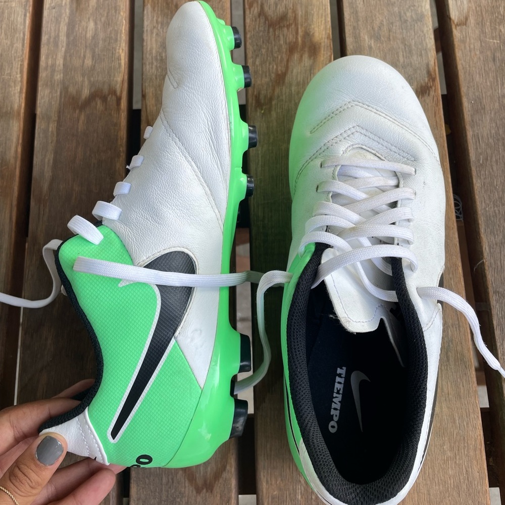 green and white Nike tiempo cleats